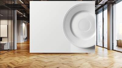 Top view of an empty plate displayed on a white background with ample copy space image available Wall mural