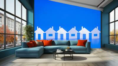 a paper cutout row of houses blue background Wall mural