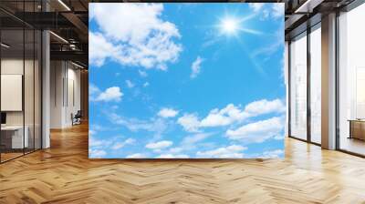 blue sky with sun and clouds background Wall mural