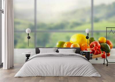 Fresh fruit in the kitchen on a wooden table by the sunny window Wall mural