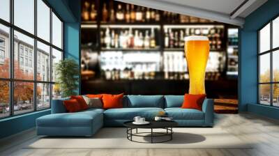 Glass of beer on wooden board and blurred bar background.Free space for your decoration.  Wall mural