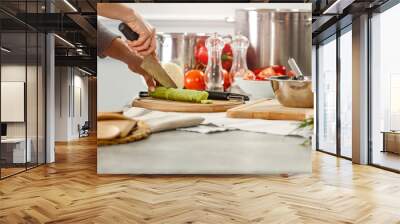 Hands in kitchen making meal.Table of free space for your decoration and fresh vegetables.  Wall mural