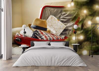 red suitcase and christmas tree decoration  Wall mural