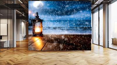 Snowy winter night landscape with wooden board top for products and decorations. Wall mural