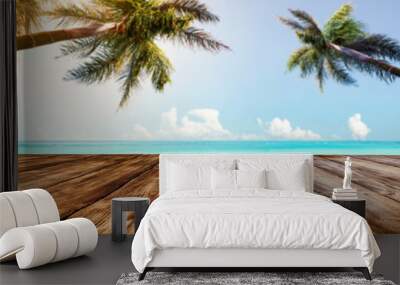 Table background of dark brown color and landscape of beach with sea and two palms.  Wall mural