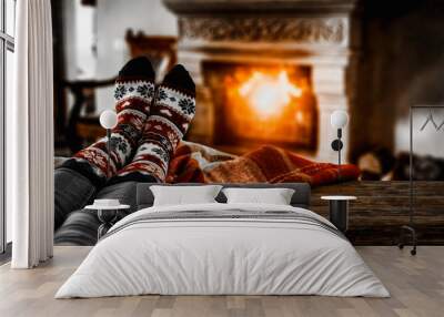 Woman legs with christmas socks and fireplace background in home interior  Wall mural