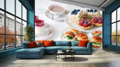 Afternoon tea with mini brioche canapes and selection of sweets Wall mural