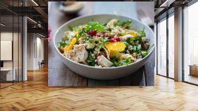 Salad with buckwheat, orange and pomegranate seeds, chicken and halloumi Wall mural