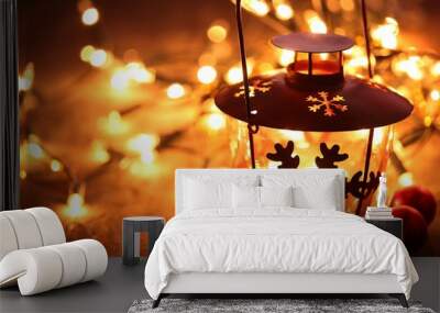 Lantern and Christmas lights burning in dark.. Wall mural