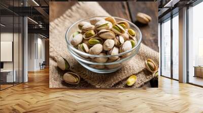 bowl of pistachios on rustic wooden table
 Wall mural