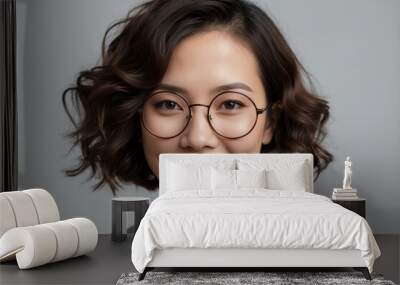 professional studio portrait of a smiling asian woman with glasses
 Wall mural