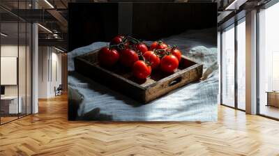 Fresh tomatoes on wooden tray on kitchen table Wall mural