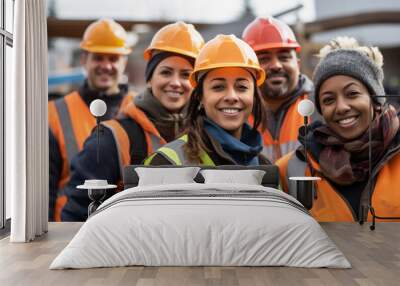 Group of male and female construction workers show unity at the construction site Wall mural