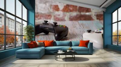 Black and white gamepad on table for two players Wall mural