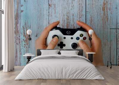 White gamepad to play with the Xbox that holds women's hands Wall mural