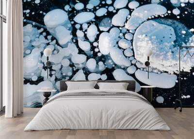 Frozen bubbles inside a frozen lake ice. Winter landscape, abstract photograph of nature. Top view, close up Wall mural