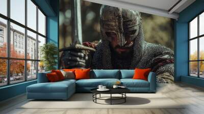 A fierce warrior in armor, holding a sword, embodies strength and bravery Wall mural