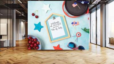 Celebrate at home 4th of July concept with photo frame and patriotic home decor. Top view from above Wall mural