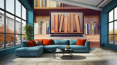 E-book library concept with laptop computer and books Wall mural