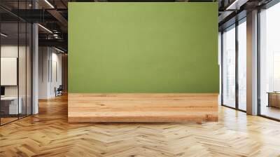 Empty wooden deck table over green wallpaper background. Mock up for product advertise Wall mural