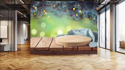 Empty wooden log with tablecloth on table over beautiful pine tree branches background.  Christmas holiday mock up for design and product display. Wall mural