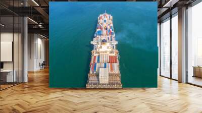 Container ship in export and import business and logistics. Shipping cargo to harbor by crane. Water transport International. Aerial view and top view. Wall mural