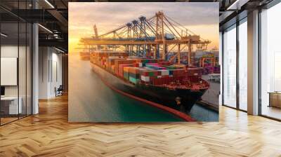 Container ship in export and import business logistics and transportation. Cargo and container box shipping to harbor by crane. Water transport International. Aerial view and top view. Wall mural