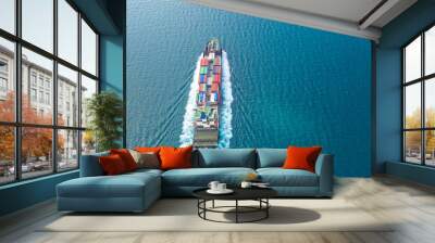 Container ship in export and import business logistics and transportation. Cargo and container box shipping to harbor by crane. Water transport International. Aerial view and top view. Wall mural