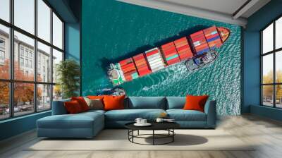 Container ship in export and import business logistics and transportation. Cargo and container box shipping to harbor by crane. Water transport International. Aerial view and top view. Wall mural