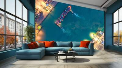 Container ship in export and import business logistics and transportation. Cargo and container box shipping to harbor by crane. Water transport International. Aerial view and top view. Wall mural