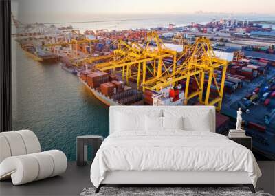 container ship in import export and business logistic.By crane ,Trade Port , Shipping.cargo to harbor.Aerial view.Top view. Wall mural