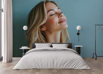 A close up of a black woman's face with her eyes closed and long blond hair Wall mural