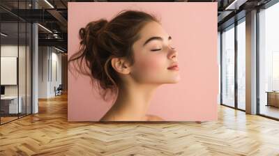 A close up of a girl's face with her eyes closed Wall mural