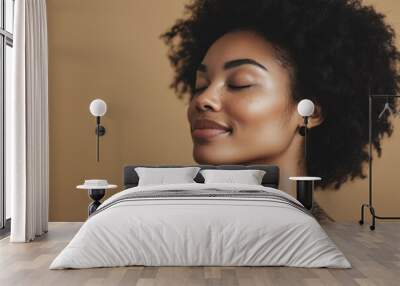 A close up of a tattooed black woman's face with her eyes closed Wall mural