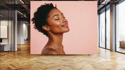 A close up of a tattooed black woman's face with her eyes closed Wall mural