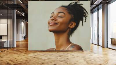 A close up of a tattooed black woman's face with her eyes closed Wall mural