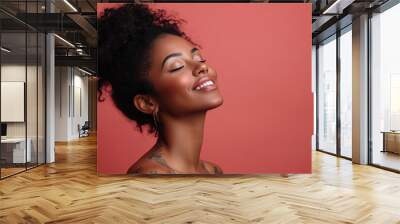 A close up of a tattooed black woman's face with her eyes closed Wall mural