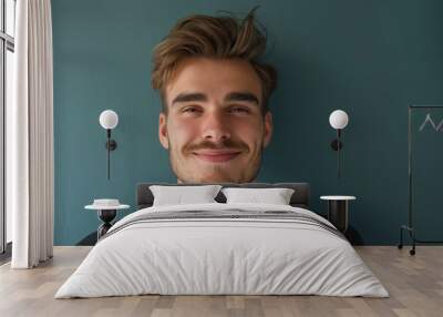 A close up portrait of a young man with a subtle smile Wall mural