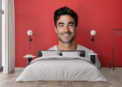 A close up portrait of a young man with a subtle smile Wall mural