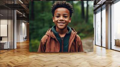 A young boy in a brown jacket is smiling for the camera Wall mural