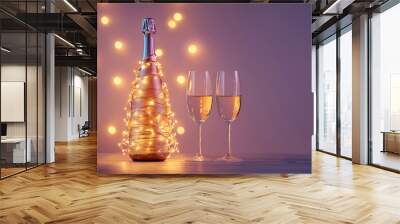 A bottle of champagne wrapped in a glowing garland like a Christmas tree with two glasses, New Year, Merry Christmas concept, Valentines day, birthday, winter wedding celebration greeting card. Wall mural