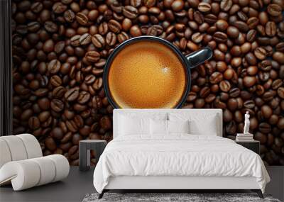 Coffee cup with coffee beans top view. Cup of freshly brewed espresso closeup on roasted coffee beans background. Wall mural