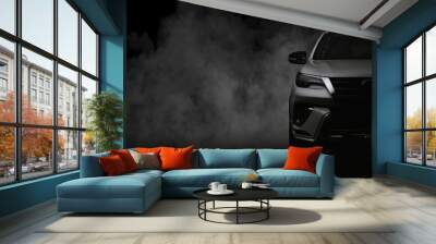 Studio shot of white car isolated on black background with shadow and smoke fog. Wall mural