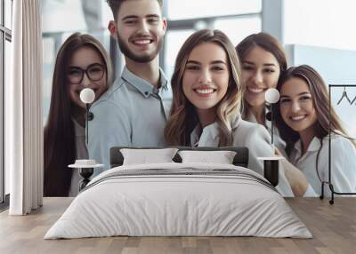 Group of business workers smiling happy and confident. Posing together with a smile on face looking at the camera, young beautiful woman with crossed arms at the office Wall mural