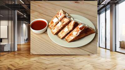 Paneer grilled sandwich served with ketchup, isolated over a rustic wooden background, selective focus Wall mural