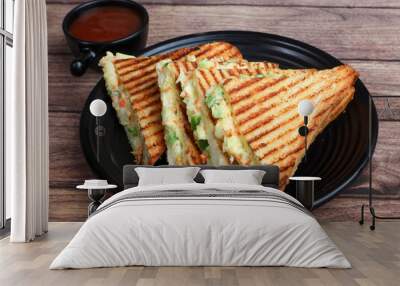 Veg grilled sandwich served with ketchup, isolated over a rustic wooden background, selective focus Wall mural