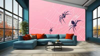 Multiple black spiders crawling on a detailed white spider web, set against a pink background Wall mural