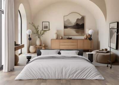 A minimalist living room with a wooden sideboard, a framed landscape photograph, and decorative vases and objects on the sideboard. The room has an arched ceiling and a neutral color palette, creating Wall mural