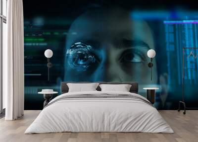 A close up of a young man eye controlling a futuristic computer system. Computer programmer coding on futuristic holographic display. Wall mural