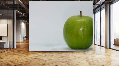 green apple with drops of water isolated on white Wall mural